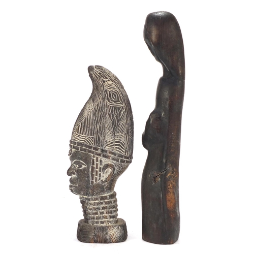 1509 - Four wood carvings including two tribal face masks, the largest 49.5cm high