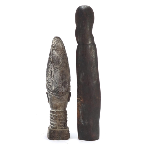 1509 - Four wood carvings including two tribal face masks, the largest 49.5cm high