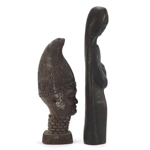 1509 - Four wood carvings including two tribal face masks, the largest 49.5cm high