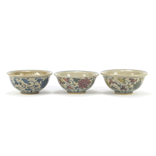 1222 - Three Chinese porcelain bowls hand painted with figures and flowers, each 14.5cm in diameter