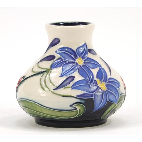 421 - Moorcroft pottery vase hand painted with a ladybird and flowers, dated 2005, 6cm high