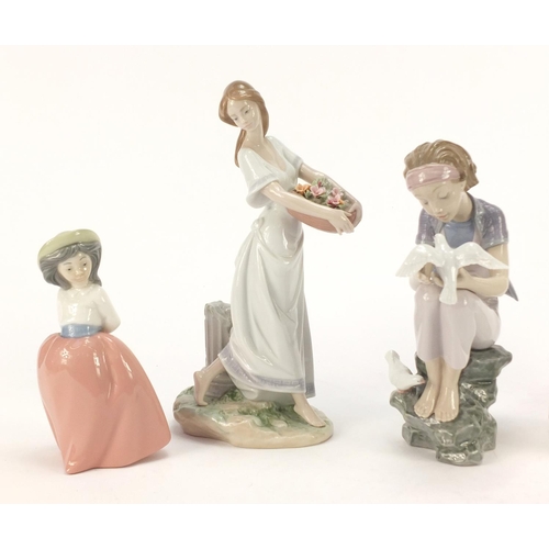 916 - Five Lladro and Nao figurines including a girl holding a basket of flowers, the largest 25.5cm high