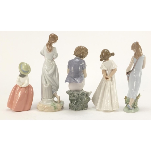 916 - Five Lladro and Nao figurines including a girl holding a basket of flowers, the largest 25.5cm high