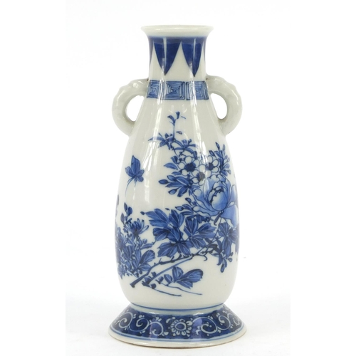 1177 - Japanese blue and white porcelain vase with twin handles, hand painted with a butterfly amongst flow... 