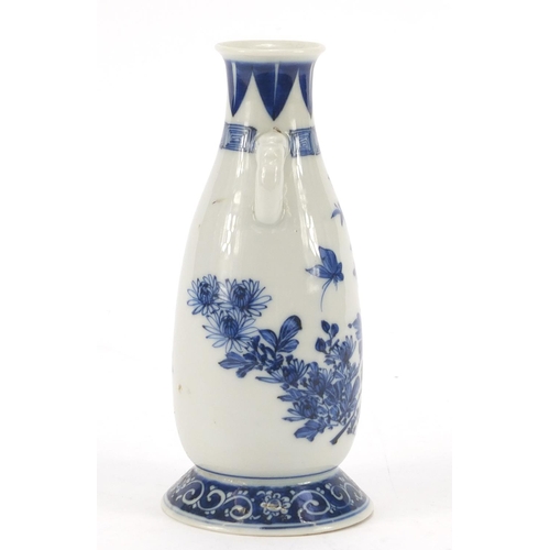 1177 - Japanese blue and white porcelain vase with twin handles, hand painted with a butterfly amongst flow... 