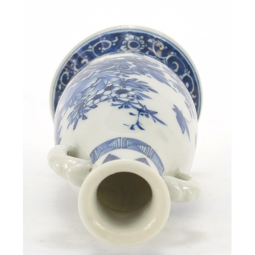 1177 - Japanese blue and white porcelain vase with twin handles, hand painted with a butterfly amongst flow... 