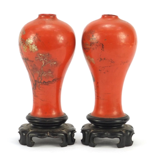 1461 - Pair of Chinese lacquered vases on stands, gilded and painted with figures and landscapes, each 21.5... 