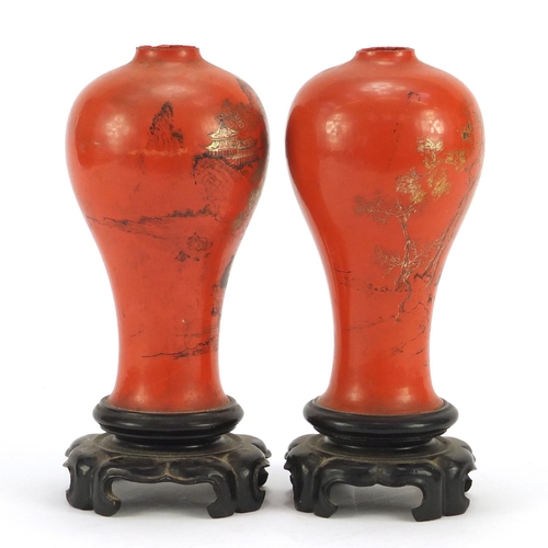 1461 - Pair of Chinese lacquered vases on stands, gilded and painted with figures and landscapes, each 21.5... 