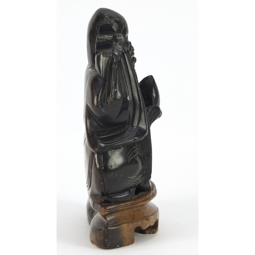 229 - Chinese soapstone carving of an Elder holding a peach and staff, 14cm high