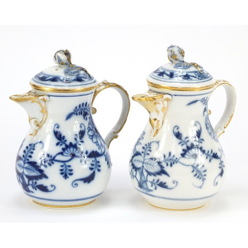 429 - Two Meissen water pots with floral knops, each hand painted in the Blue onion pattern, crossed sword... 