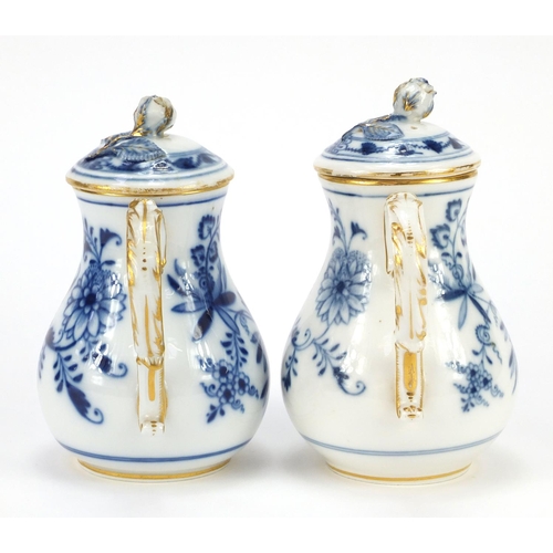 429 - Two Meissen water pots with floral knops, each hand painted in the Blue onion pattern, crossed sword... 