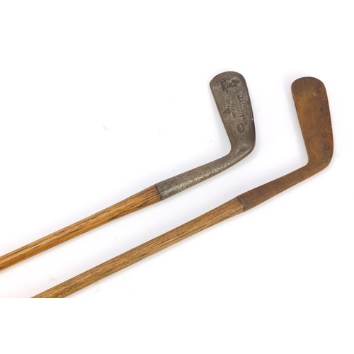 774 - Two wooden shafter putters including one by H E Pearse, the largest 89cm in length