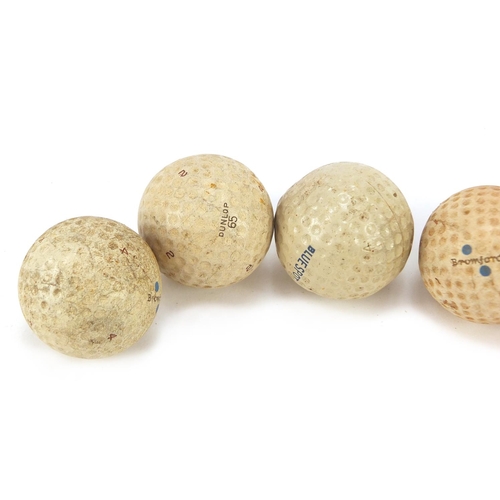 779 - Six Vintage golf balls including Par Player, Blue Spot, Bromford, Dunlop 65 and Slazenger