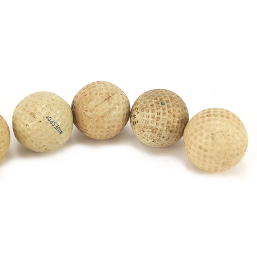 779 - Six Vintage golf balls including Par Player, Blue Spot, Bromford, Dunlop 65 and Slazenger