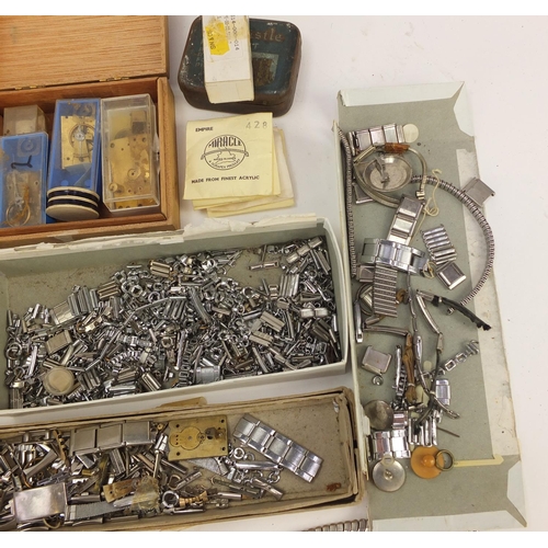 483A - Collecton of Antique and later watch parts including crystals, movements and straps