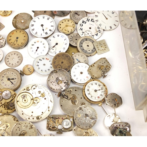 483A - Collecton of Antique and later watch parts including crystals, movements and straps