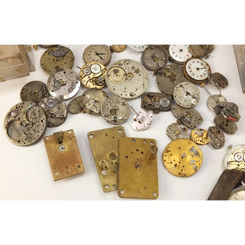 483A - Collecton of Antique and later watch parts including crystals, movements and straps