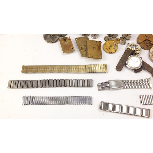 483A - Collecton of Antique and later watch parts including crystals, movements and straps