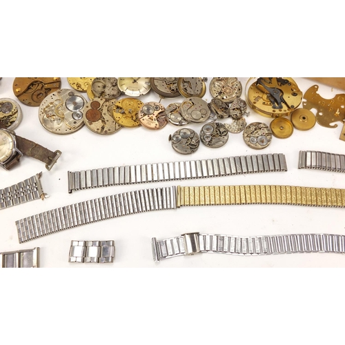 483A - Collecton of Antique and later watch parts including crystals, movements and straps