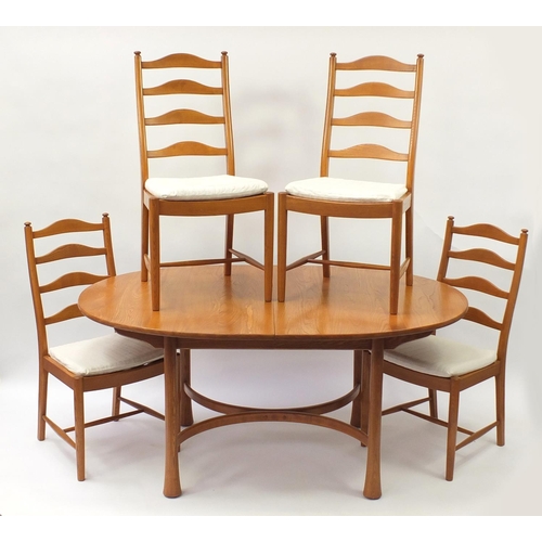 1596 - Ercol elm oval extending dining table with four chairs, the table 94.5cm H x 163cm W x 107.5cm D