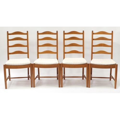 1596 - Ercol elm oval extending dining table with four chairs, the table 94.5cm H x 163cm W x 107.5cm D