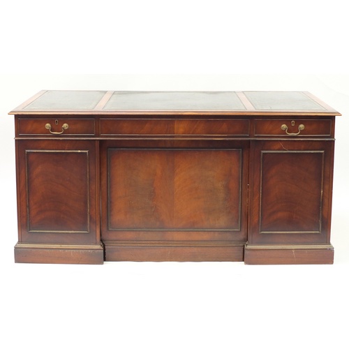 1594 - Mahogany twin pedestal desk with brushing slides and nine drawers, 75cm H x 157cm W x 87.5cm D