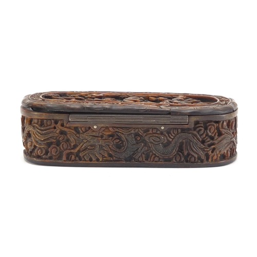 634 - Chinese Canton tortoiseshell snuff box having a hinged lid and inset silver cartouche, carved with d... 