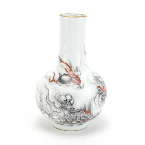 60 - Chinese porcelain vase hand painted with a dragon chasing a flaming pearl amongst clouds, six figure... 