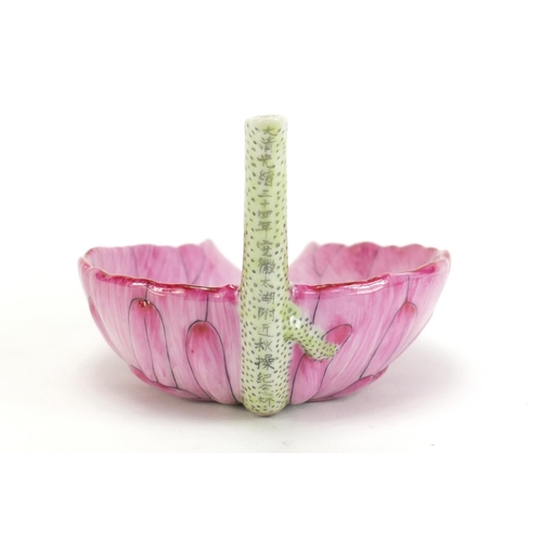 738 - Chinese porcelain lotus leaf libation cup, character marks to the spout, 17cm in length