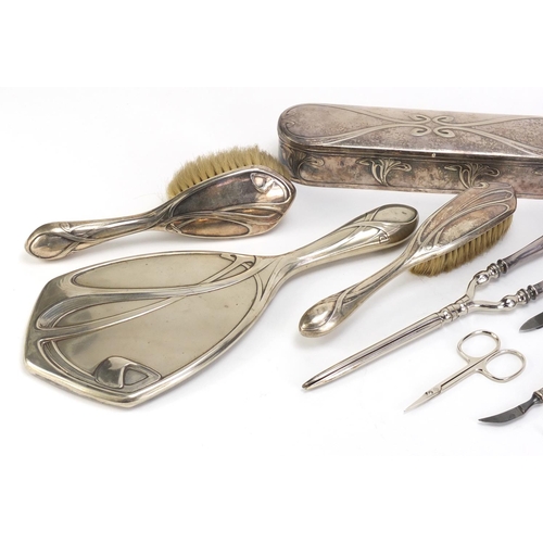 184 - Art Nouveau silver plated vanity metalware, including hand mirror, brushes and hair curlers each imp... 