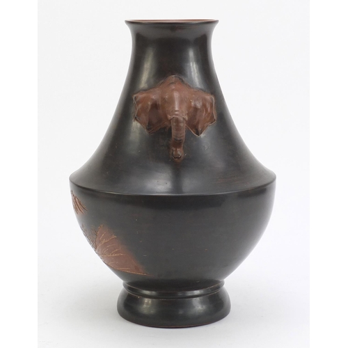 128 - Chinese Yixing teracotta vase with elephant head handles, incised with a landscape, 33cm high