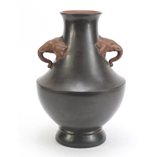 128 - Chinese Yixing teracotta vase with elephant head handles, incised with a landscape, 33cm high