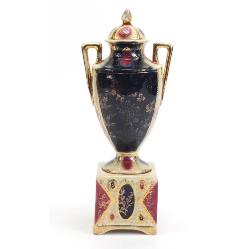 1138 - Royal Vienna twin handled vase and cover on stand, decorated with mother and child, 30.5cm high