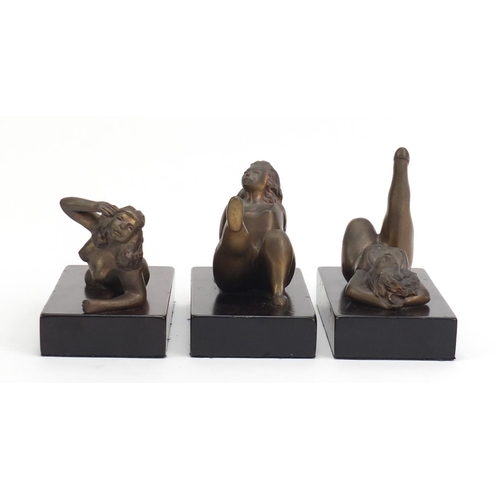 250 - Three South African bronze sculptures of nude females raised on a rectangular wood bases by Jean Doy... 