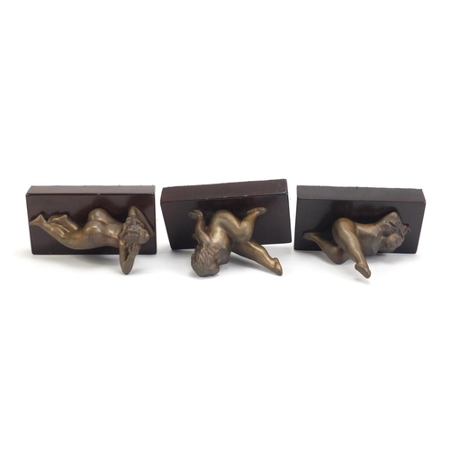 250 - Three South African bronze sculptures of nude females raised on a rectangular wood bases by Jean Doy... 