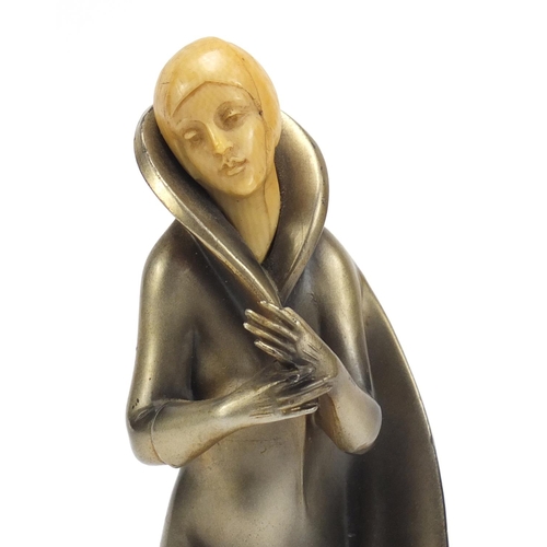 157 - Art Deco bronzed figure of a female with carved ivory head, raised on a shaped onyx base, 25cm high