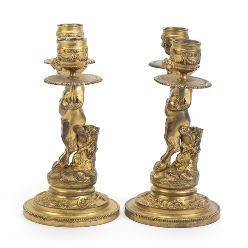 44 - Pair of gilt bronze pan design two branch candlesticks, each 19.5cm high
