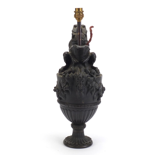 41 - Classical patinated bronze pan design pitcher lamp, decorated in relief with berries and leaves, 47c... 