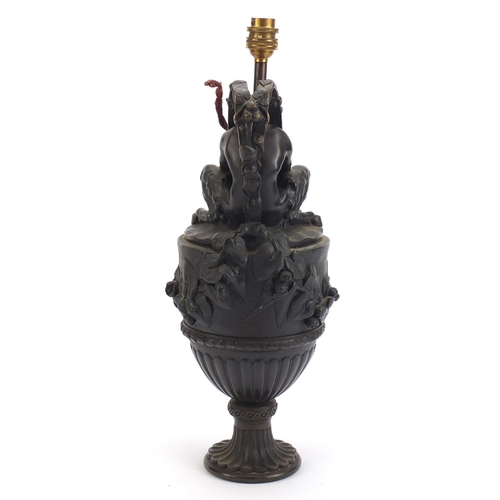 41 - Classical patinated bronze pan design pitcher lamp, decorated in relief with berries and leaves, 47c... 