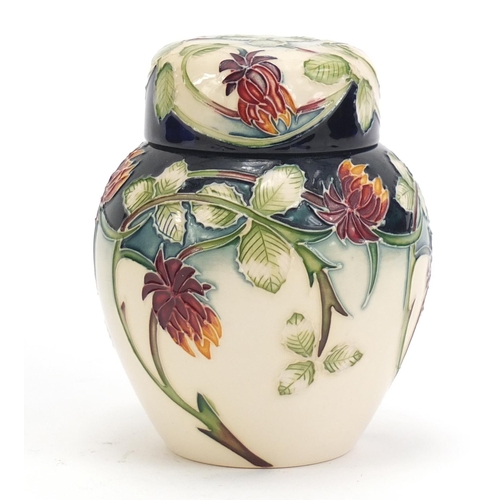 140 - Moorcroft pottery ginger jar and cover hand painted with flowers, dated 2002, 11cm high