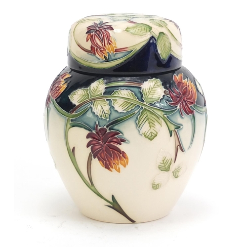 140 - Moorcroft pottery ginger jar and cover hand painted with flowers, dated 2002, 11cm high
