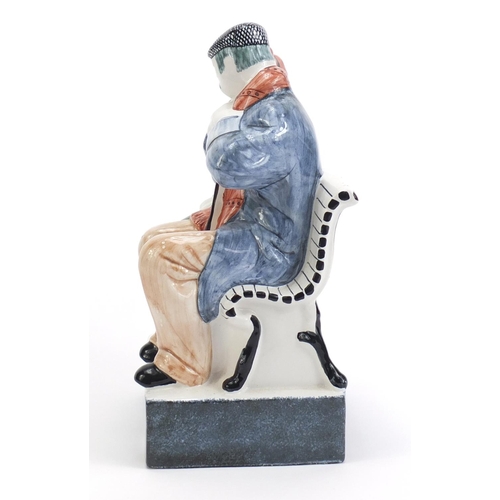 1137 - Rye Pottery group of two figures on a bench, 21cm high