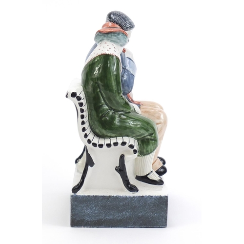 1137 - Rye Pottery group of two figures on a bench, 21cm high