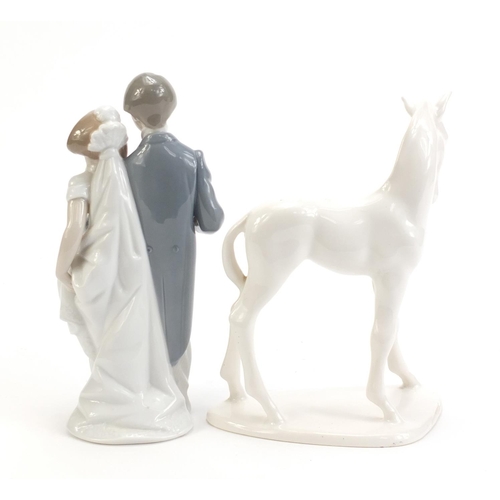 1132 - Lladro figure group of a bride and groom together with a Villeroy & Boch foal, the largest 21cm high