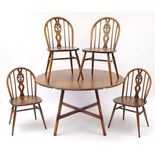 1587 - Ercol elm dining table and four chairs, the table 72cm high x 113cm deep when closed