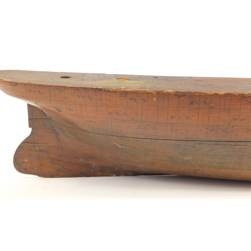684 - Large shipping interest wooden boat builders half hull model with ink inscriptions, 112cm in length