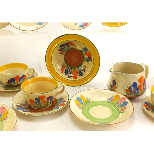 137 - Art Deco Clarice Cliff teaware hand painted in the Crocus pattern including cups, plates and milk ju... 