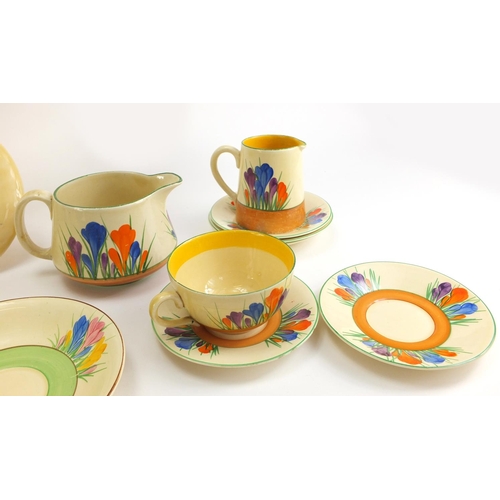 137 - Art Deco Clarice Cliff teaware hand painted in the Crocus pattern including cups, plates and milk ju... 