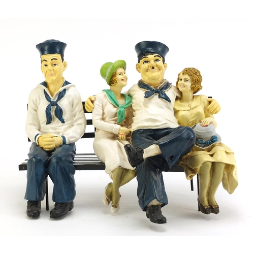 1198A - Painted model of Laurel & Hardy on a park bench, 28.5cm wide