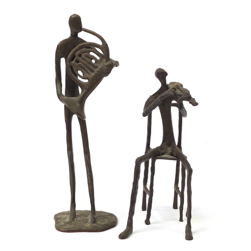182 - Two Modernist patinated bronze musicians in the style of Alberto Giacometti, 30.5cm high